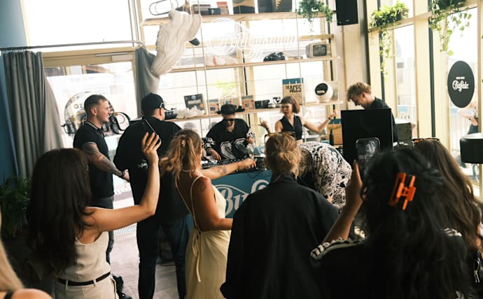Behind-the-scenes event at a BUFFALO store, with guests gathering around a live DJ set during a brand activation.