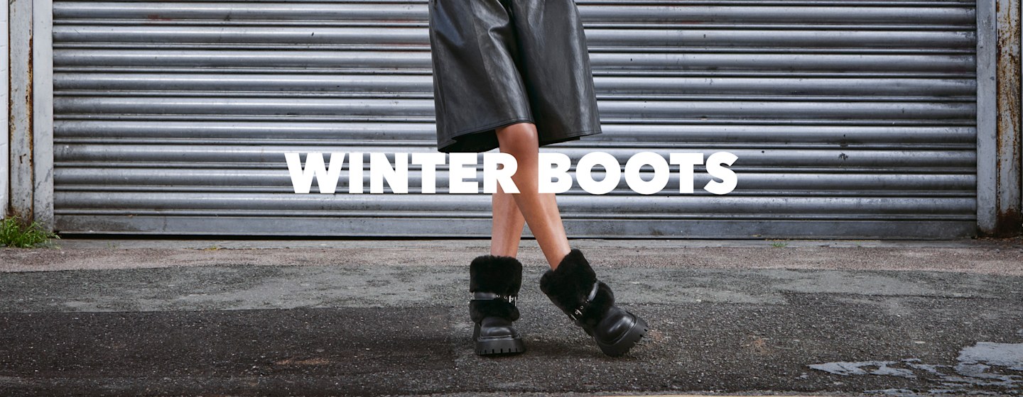 Person wearing black faux-fur winter boots with chunky sole and “Winter Boots” campaign text