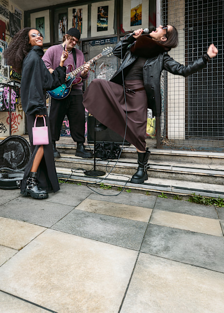 Street-style campaign featuring BUFFALO boots, live music and models in an urban setting.